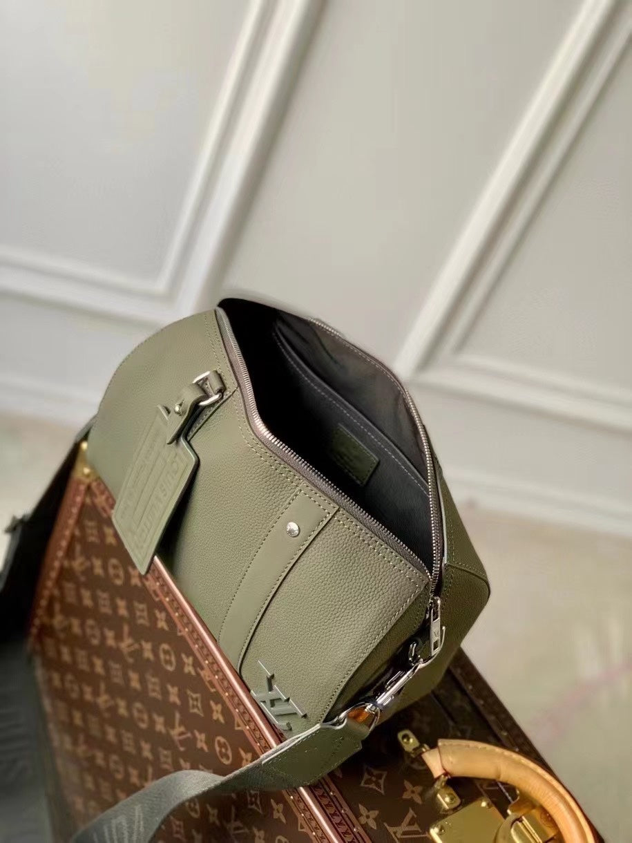 Chic Olive Green Louis Vuitton Crossbody Bag With Textured Leather And Signature Details
