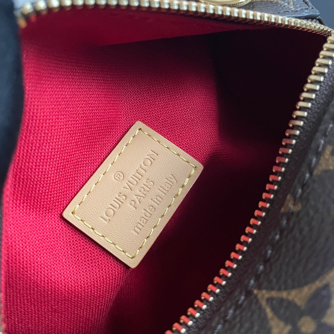 Stylish Louis Vuitton Nano Speedy Bag with Iconic Monogram and Luxe Leather Details