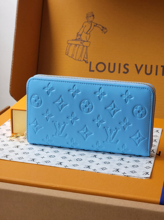 Elegant Louis Vuitton Black Embossed Leather Zip Around Wallet With Gold Accents