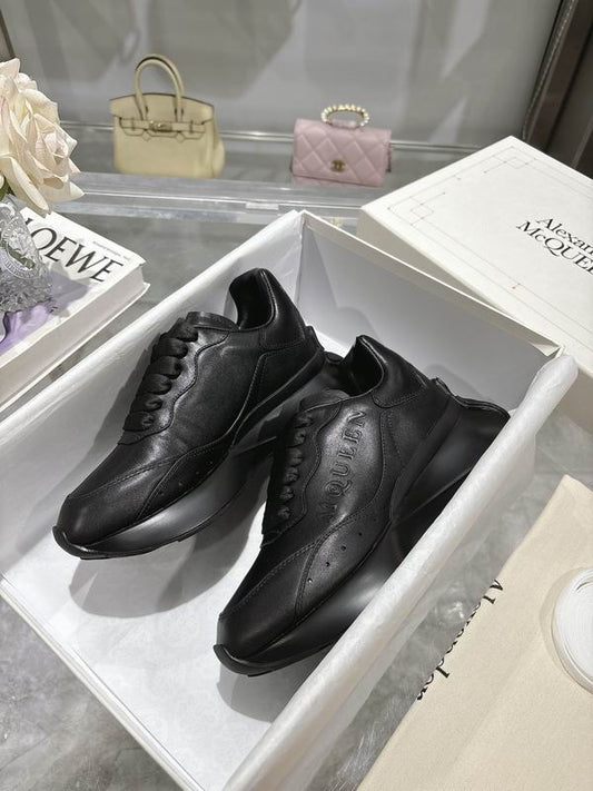 Sleek All Black Alexander McQueen Oversized Sneakers For Timeless Street Style