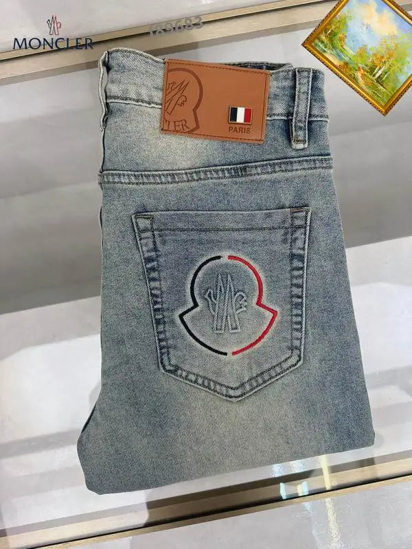 Moncler Men's Jeans with Light Wash and Unique Embroidered Detail