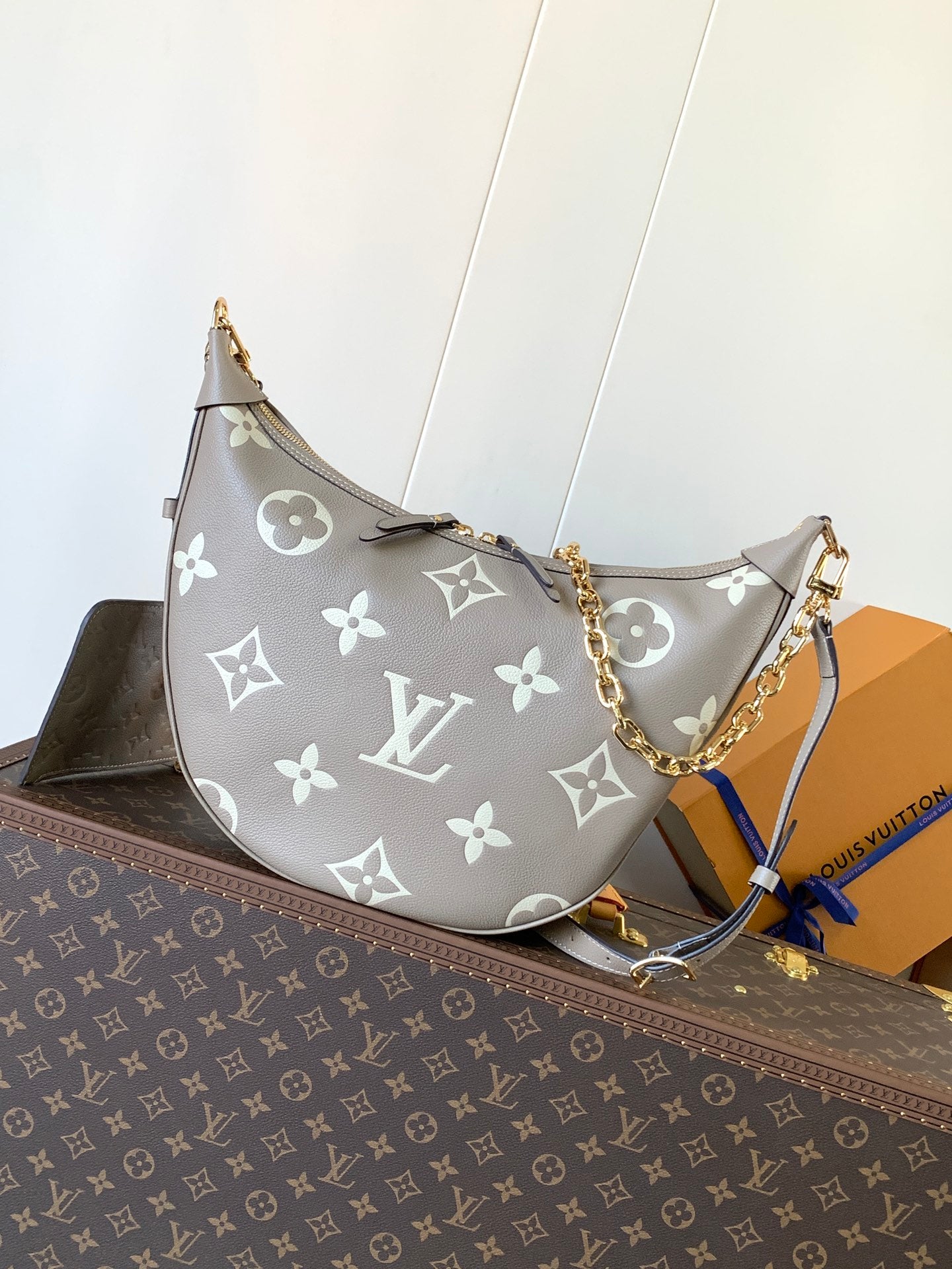 Louis Vuitton Black Embossed Leather Moon Bag With Gold Chain Stylish Luxury Shoulder Accessory