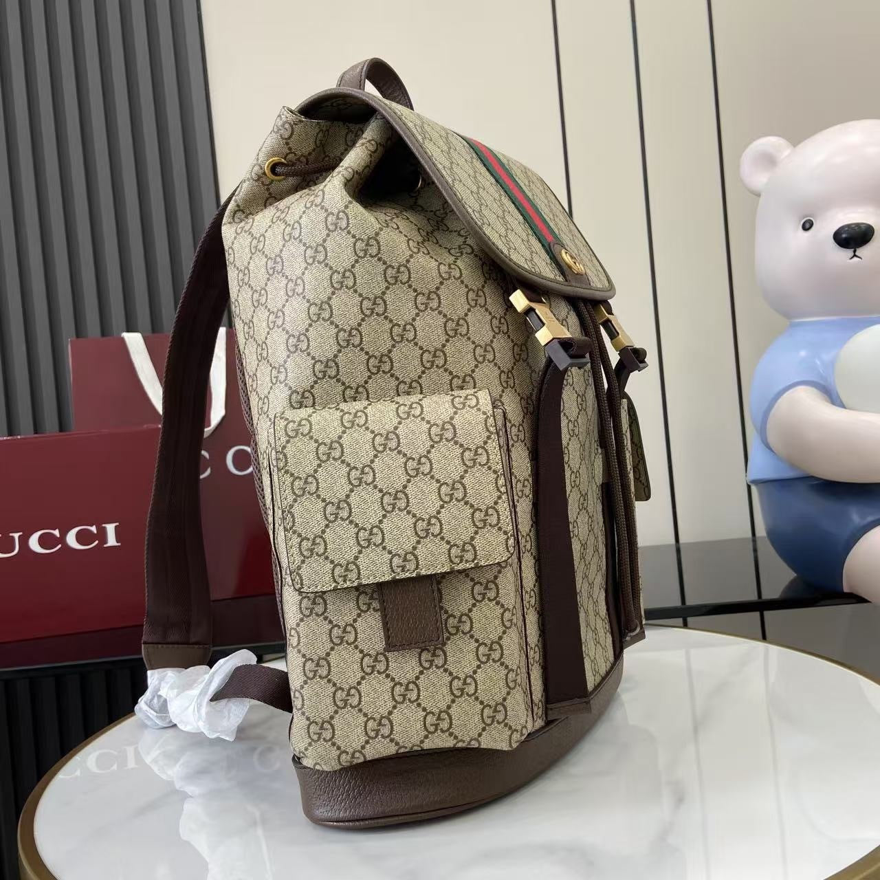 Classic Gucci Backpack With Iconic GG Pattern Web Stripe And Gold Accents For Timeless Style 839110