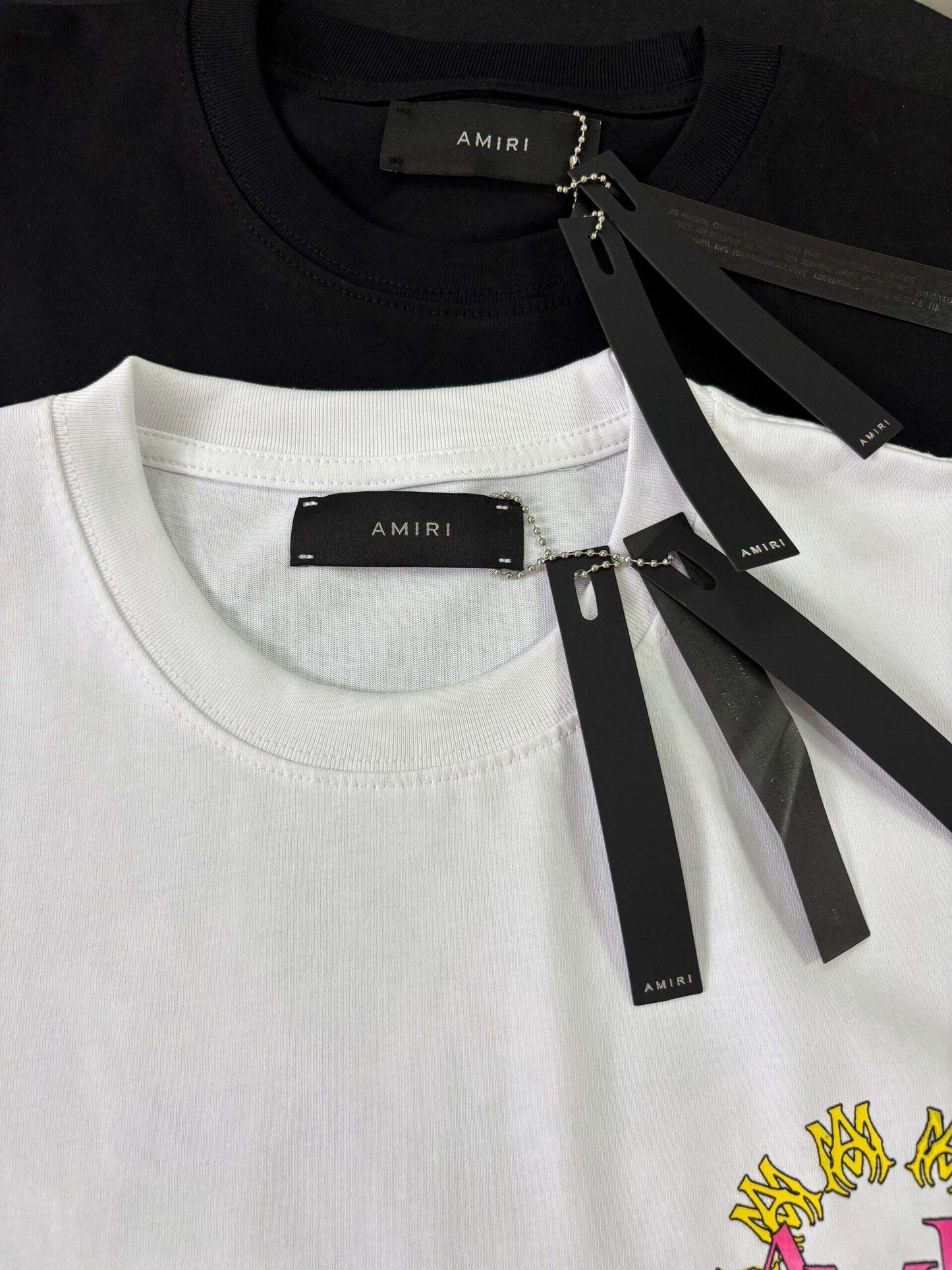 AMIRI Black/White Tee With Colorful Circular Logo For Trendy Streetwear Enthusiasts