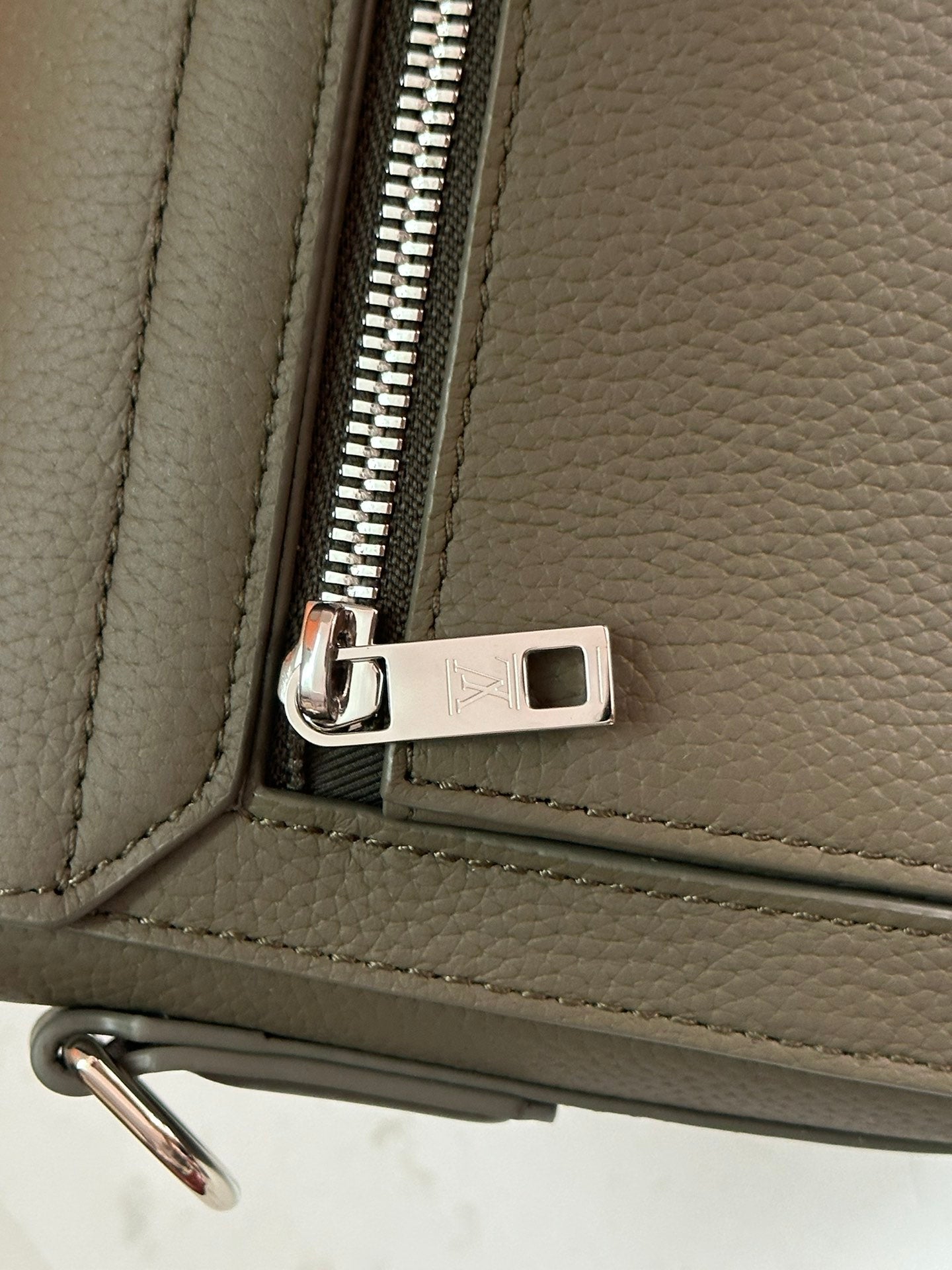Elegant Louis Vuitton Gray Leather Crossbody Bag With Iconic LV Logo For Sophisticated Style M24769
