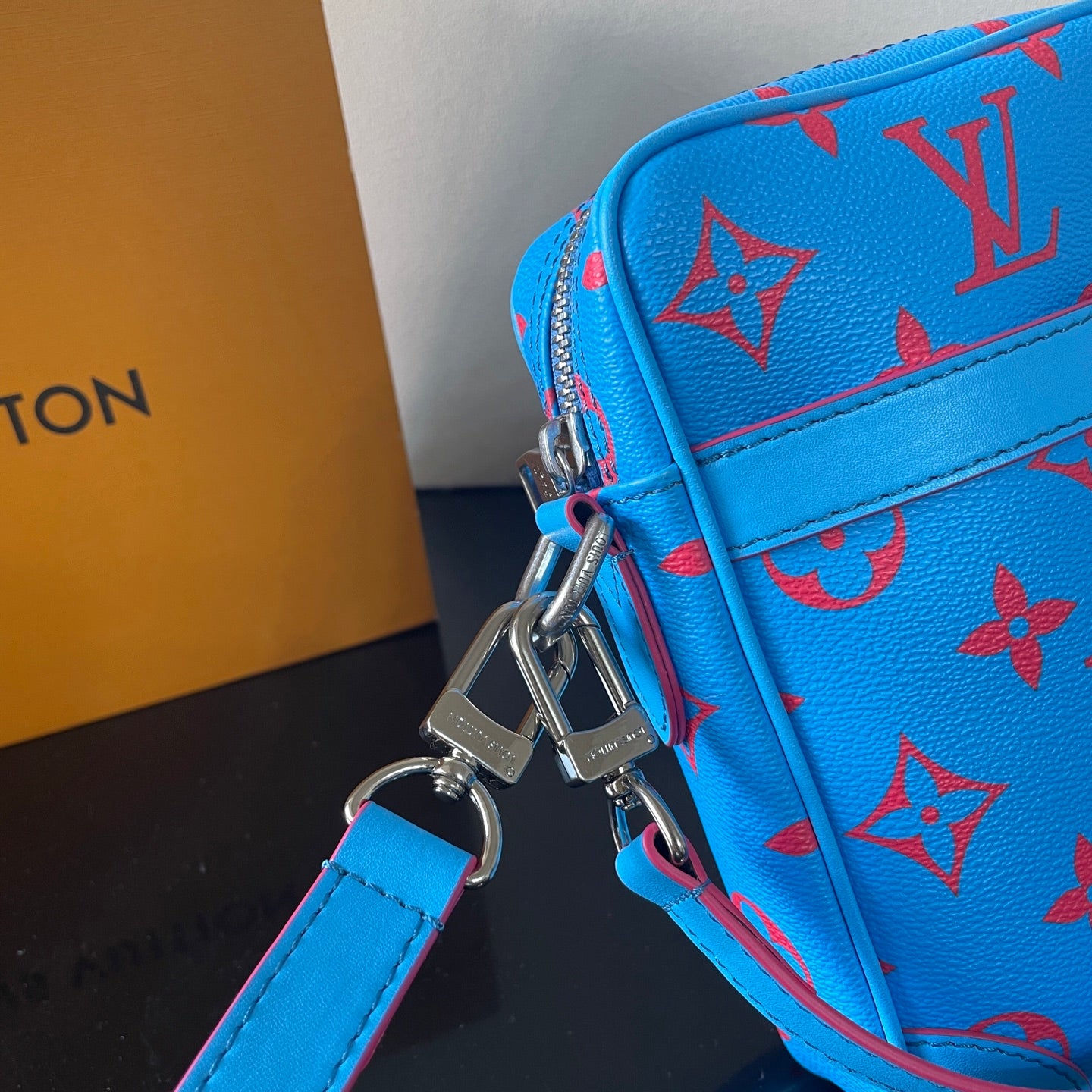 Eye Catching Blue Louis Vuitton Crossbody Bag With Red Monogram Pattern And Adjustable Strap