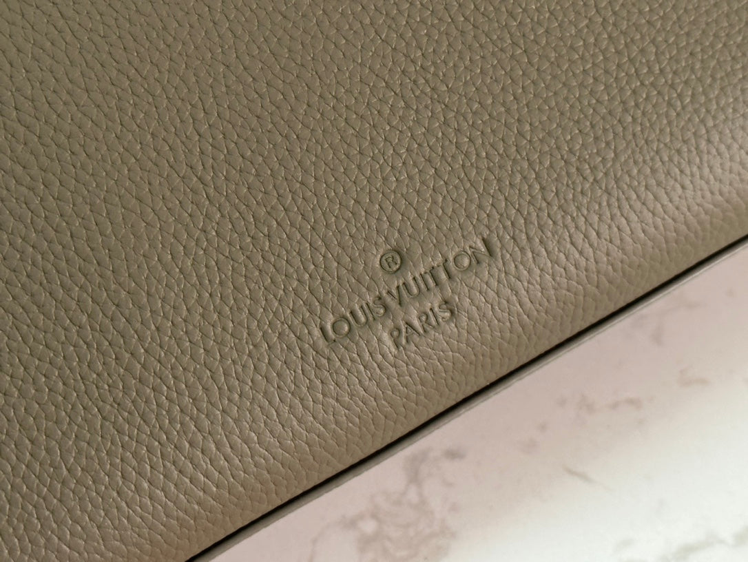 Elegant Louis Vuitton Gray Leather Crossbody Bag With Iconic LV Logo For Sophisticated Style M24769
