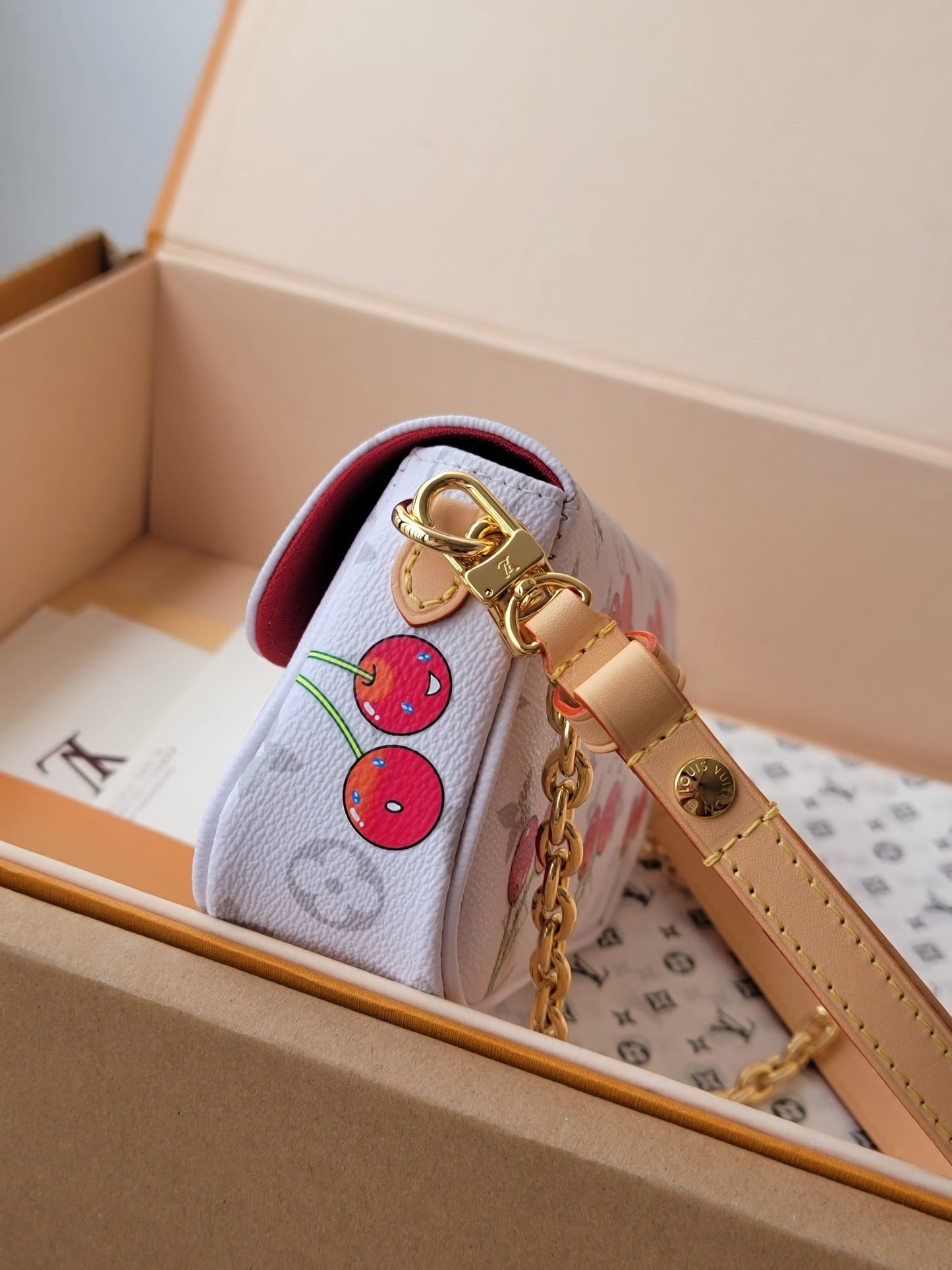 Stylish Louis Vuitton Cherry - Printed Bag With Gold Chain For Fashion Enthusiasts