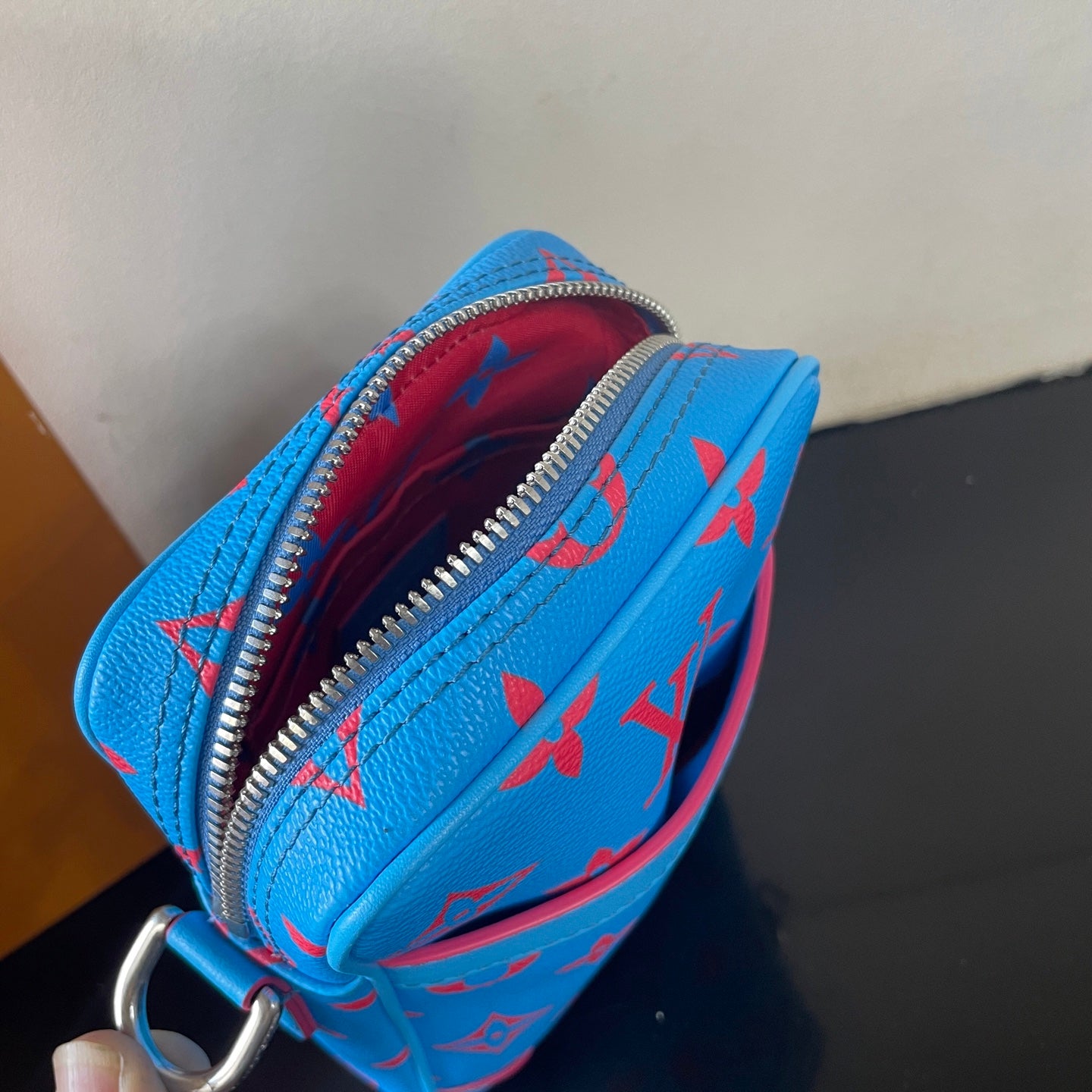 Eye Catching Blue Louis Vuitton Crossbody Bag With Red Monogram Pattern And Adjustable Strap