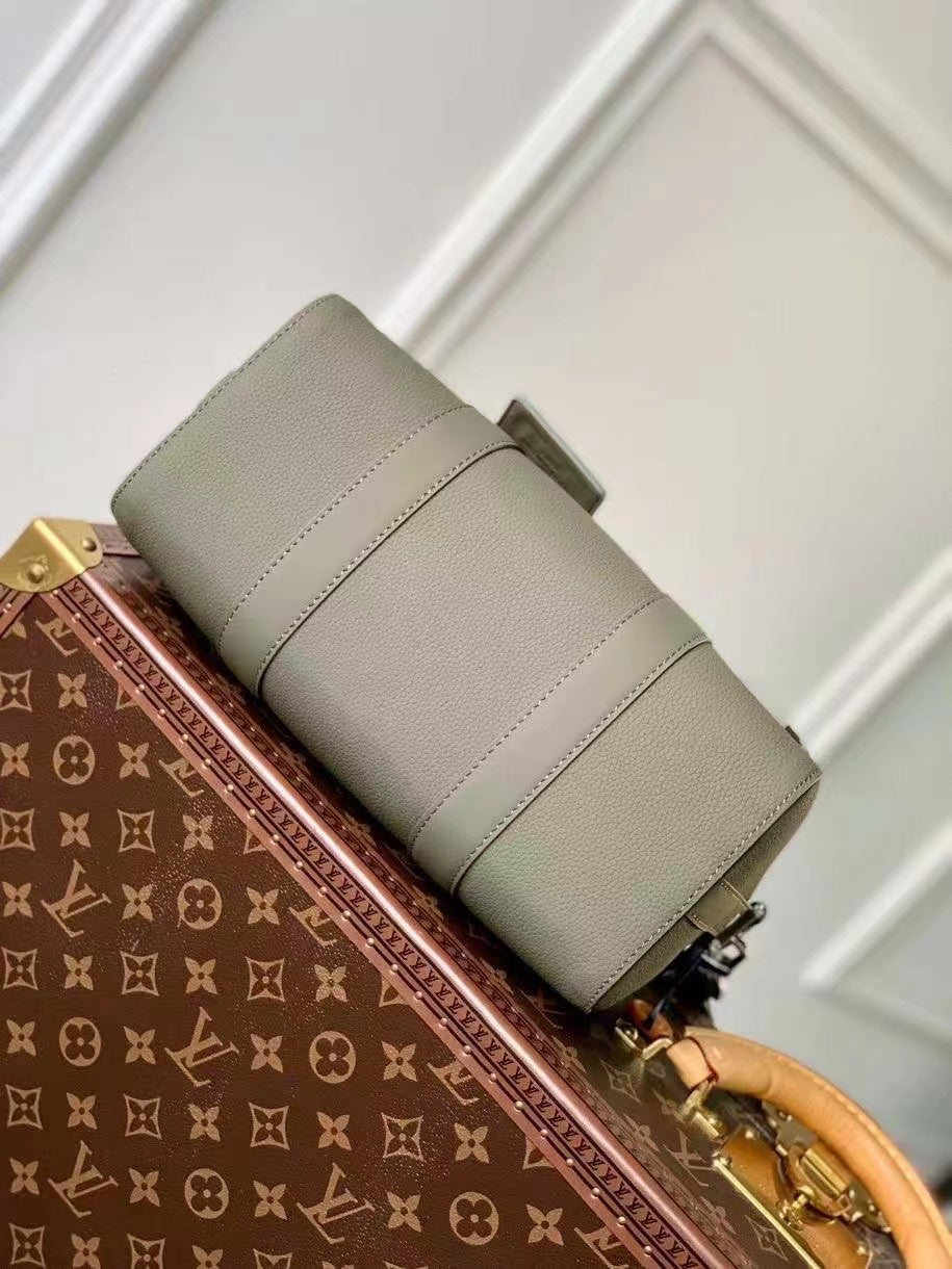 Chic Olive Green Louis Vuitton Crossbody Bag With Textured Leather And Signature Details