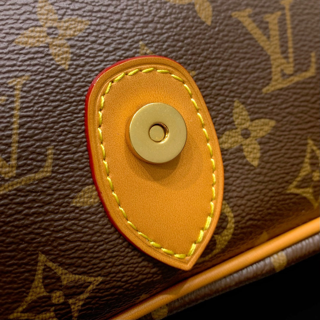 Classic Louis Vuitton Monogram Messenger Bag With Tan Leather Accents And Buckles