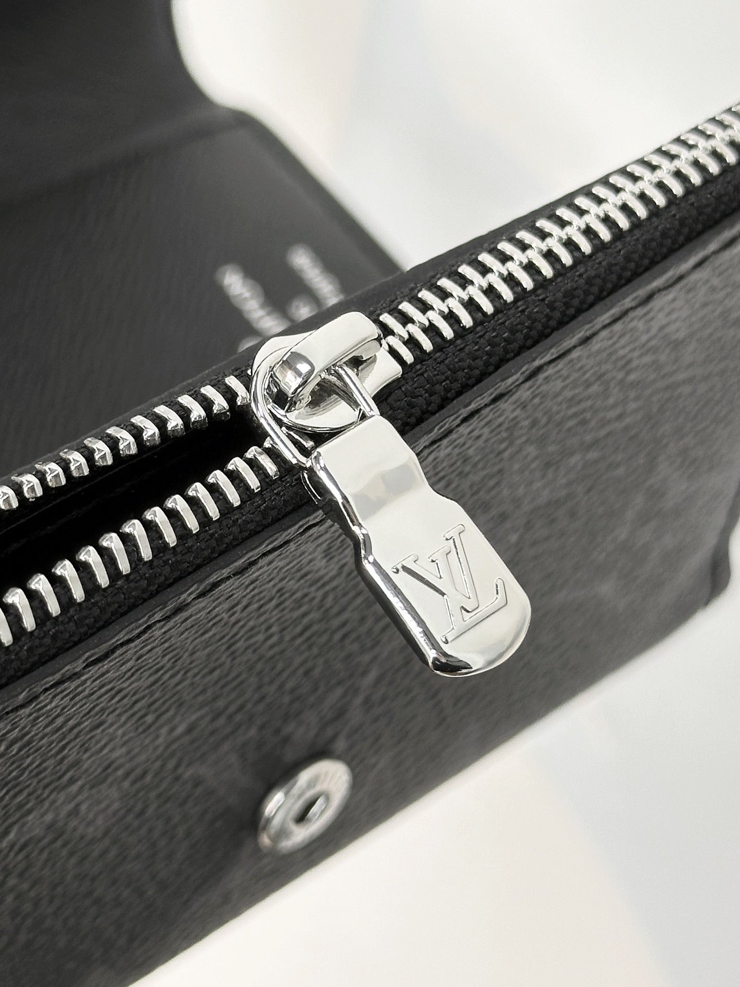 Stylish Louis Vuitton Black Monogram Wallet With Silver Button For Sophisticated Accessory M12598
