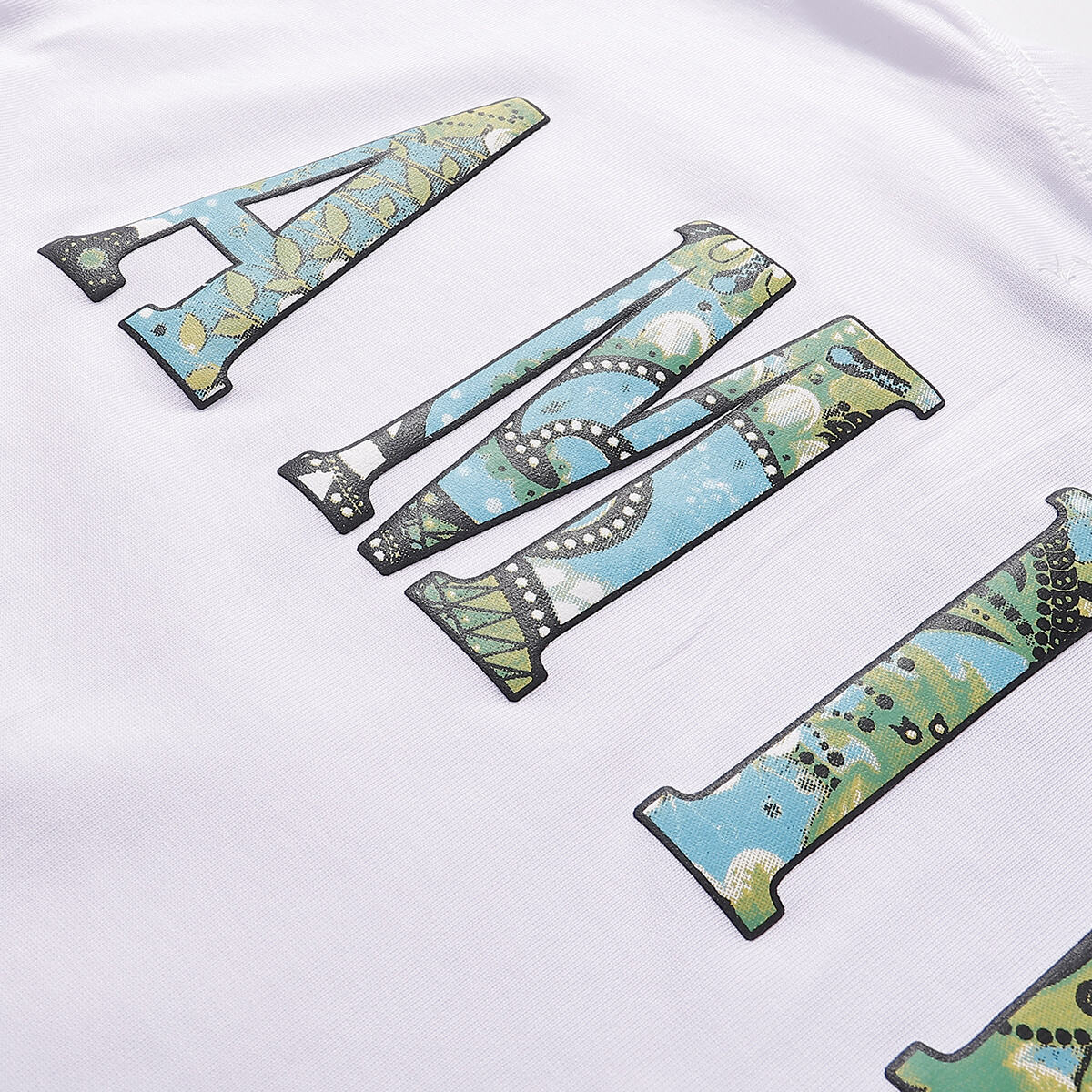 AMIRI White/Black Tee With Colorful Camo Logo For Stylish Streetwear Looks