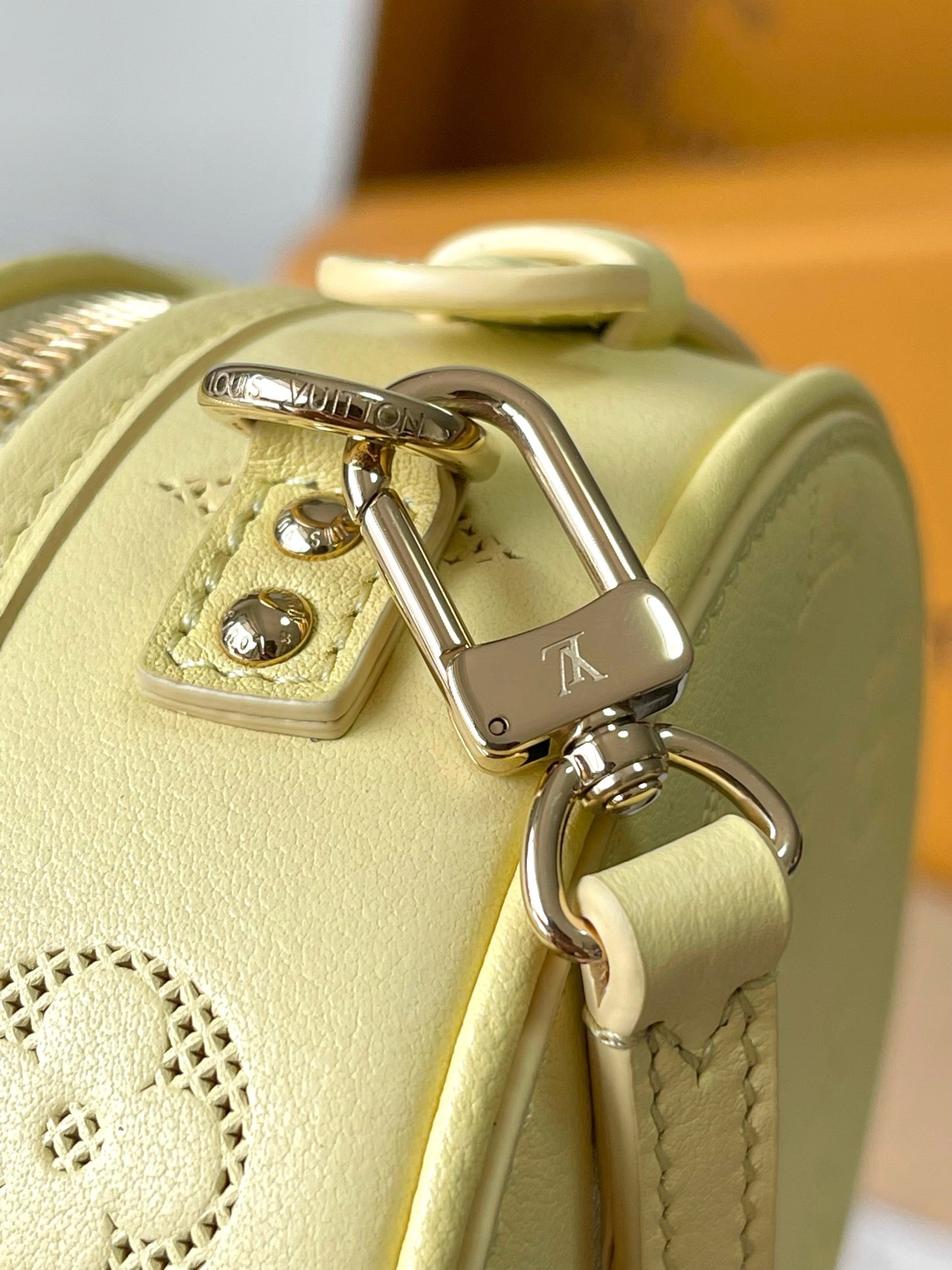 Chic Yellow LV Embossed Round Crossbody Bag With Adjustable Strap And Signature Details