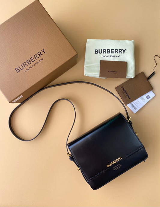Elegant Black/Brown Burberry Crossbody Bag With Gold Branding And Adjustable Strap Style No.595155