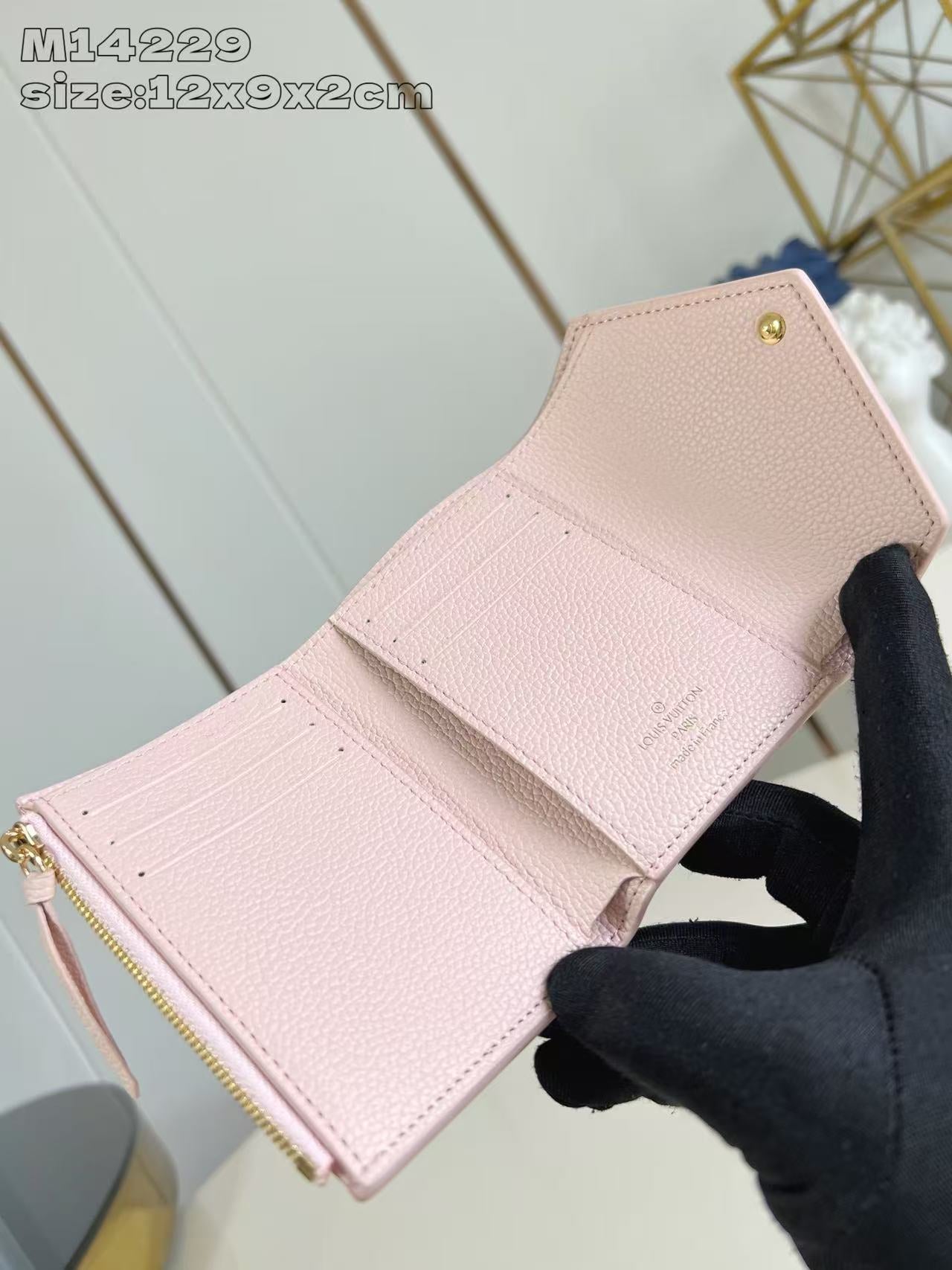 Chic Louis Vuitton Pink Leather Wallet With Embossed Monogram And Gold Accent M14229