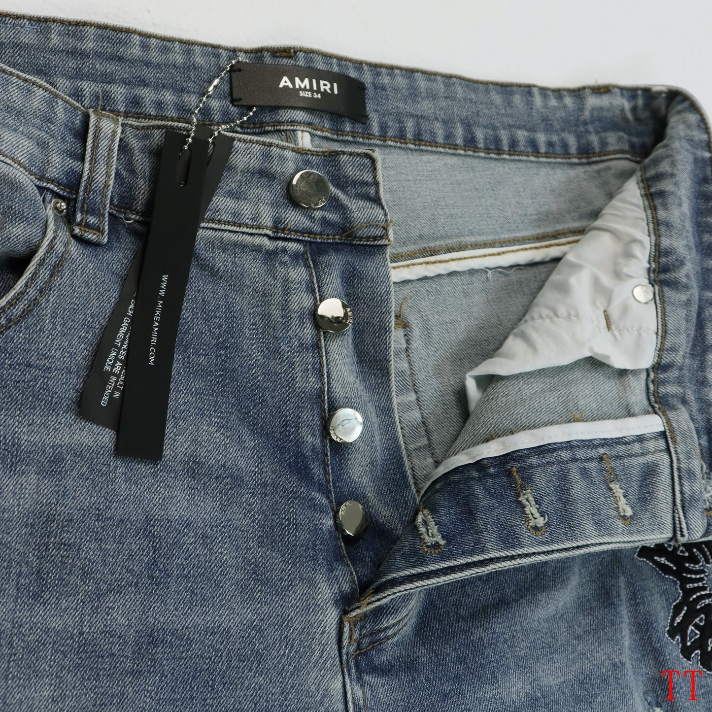Amiri Light Blue Distressed Jeans With Colorful Embroidered Patterns