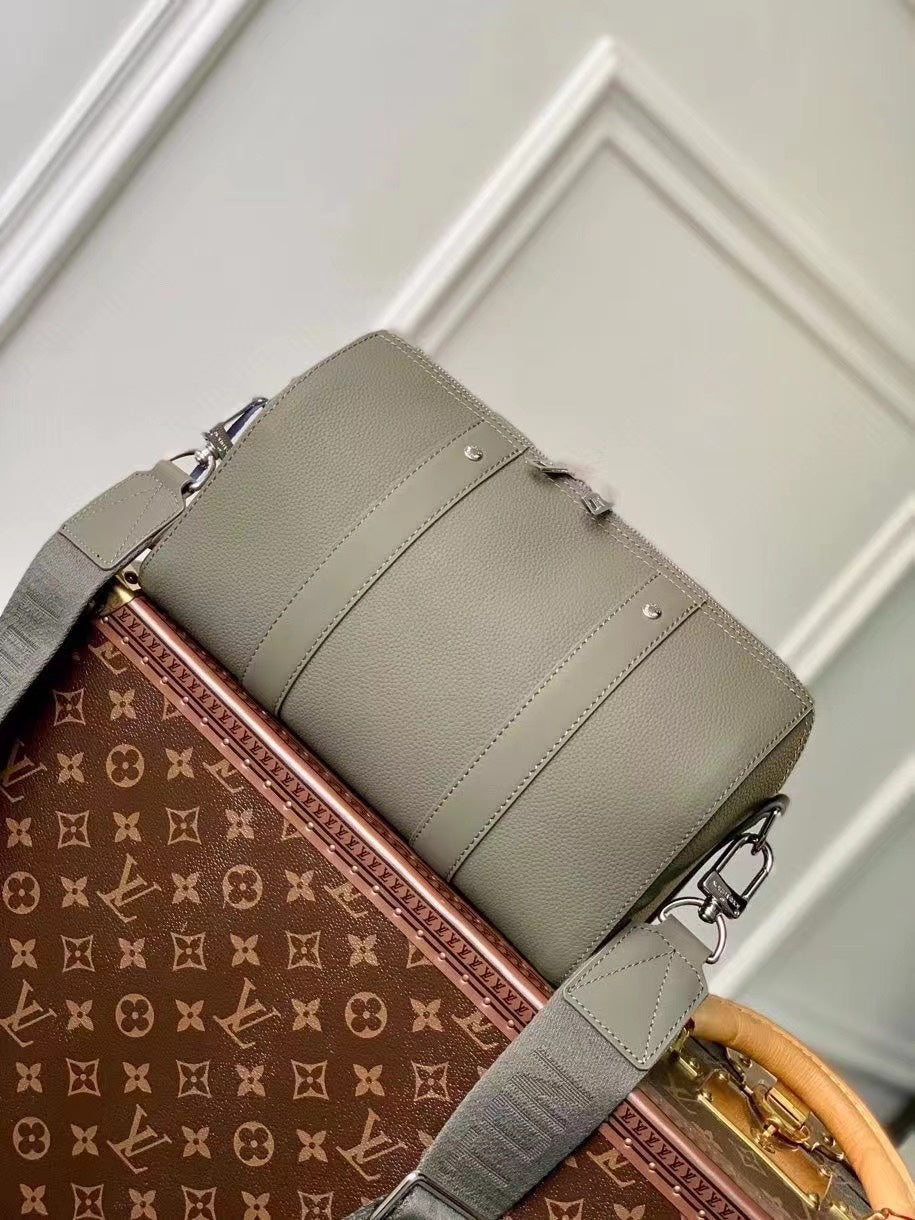 Chic Olive Green Louis Vuitton Crossbody Bag With Textured Leather And Signature Details