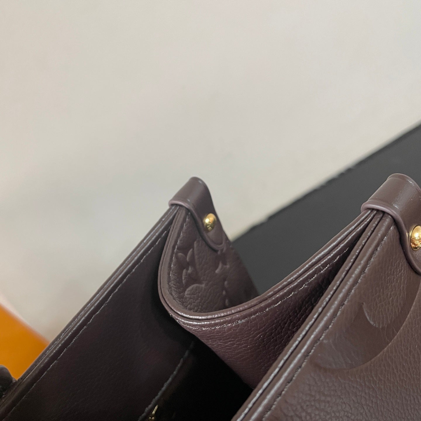Elegant Louis Vuitton Gray Embossed Leather Tote Bag With Signature Monogram Patterns