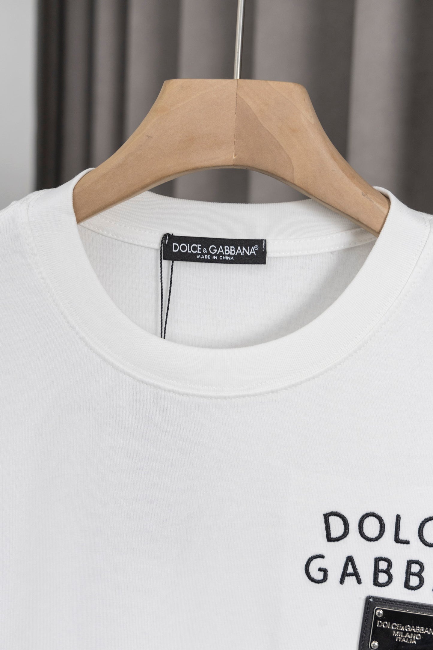 Elegant Dolce & Gabbana White/Black T - Shirt With Signature Branding For Fashion Enthusiasts