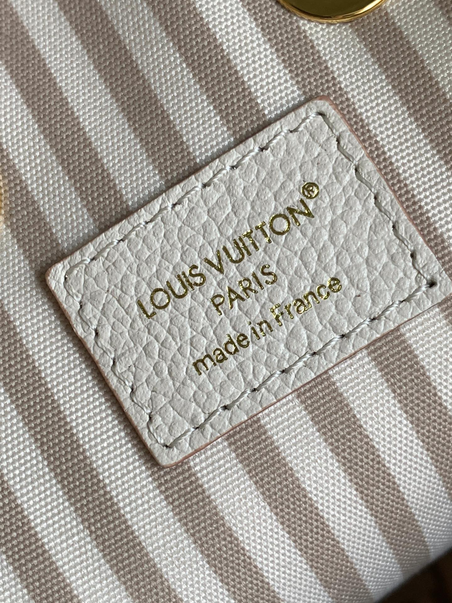 Chic Louis Vuitton White Monogram Empreinte Bucket Bag for Fashion - Forward Style