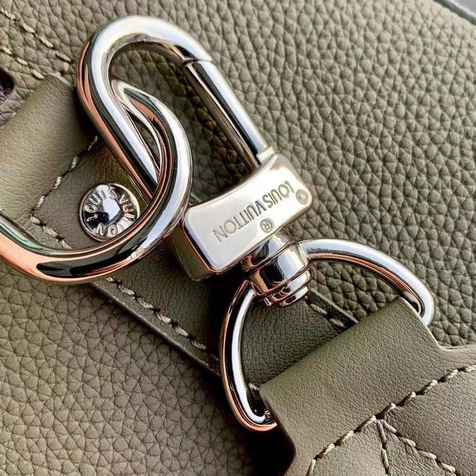 Chic Olive Green Louis Vuitton Crossbody Bag With Textured Leather And Signature Details