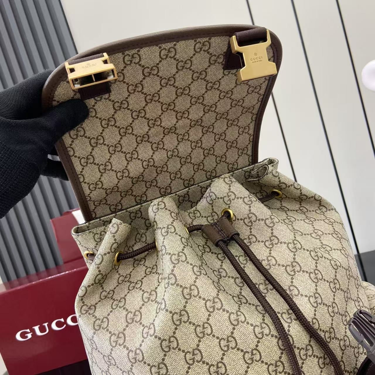 Classic Gucci Backpack With Iconic GG Pattern Web Stripe And Gold Accents For Timeless Style 839110