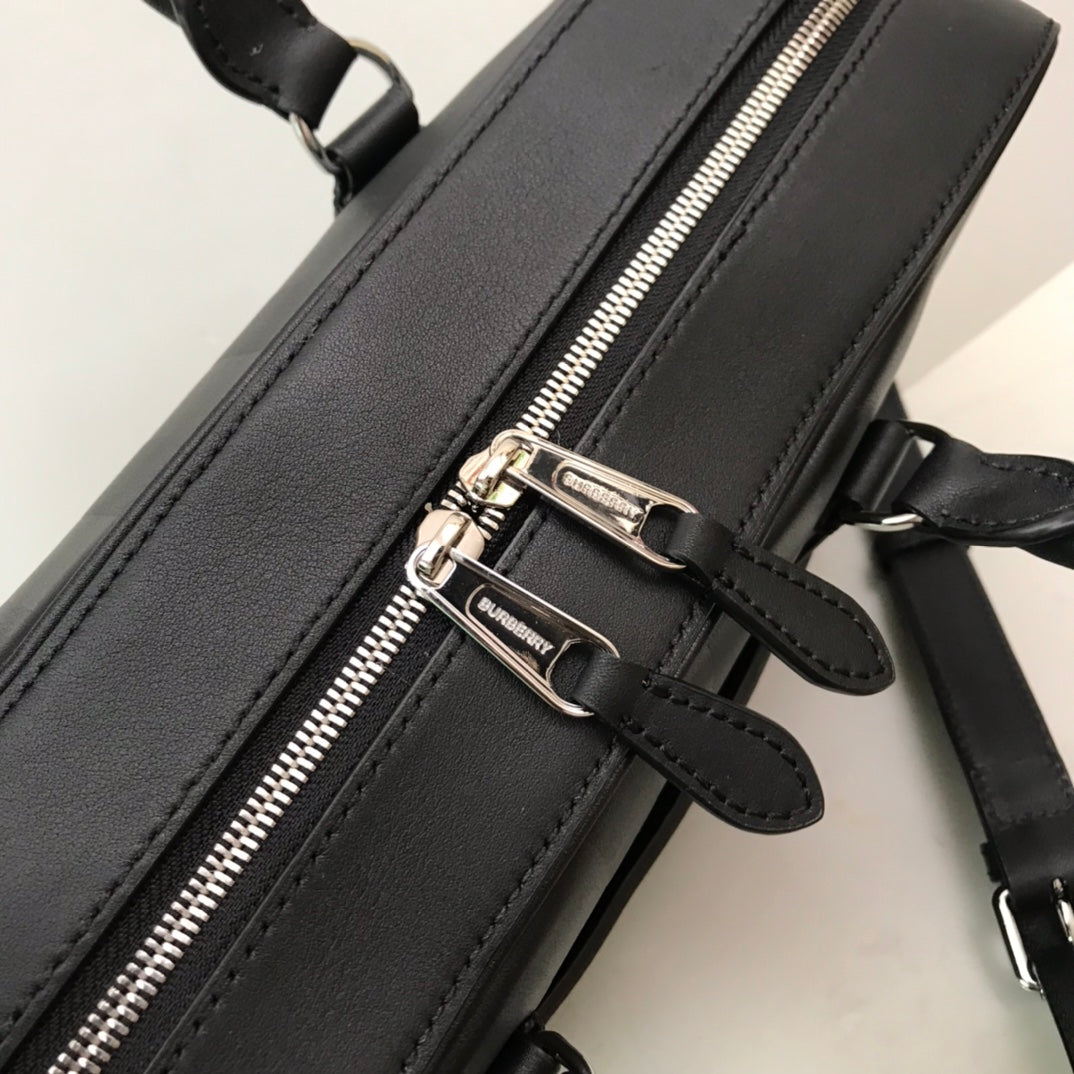 Sleek Black Burberry Briefcase With Woven Texture For Sophisticated Business And Travel Looks