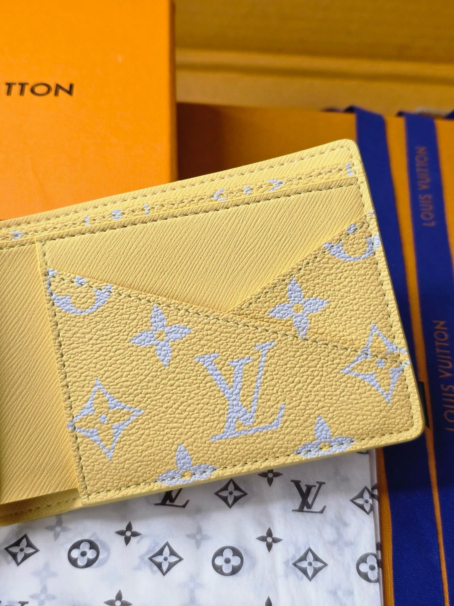Elegant Louis Vuitton Light Blue Wallet With Gold Monogram And Sparkling Accents M14694