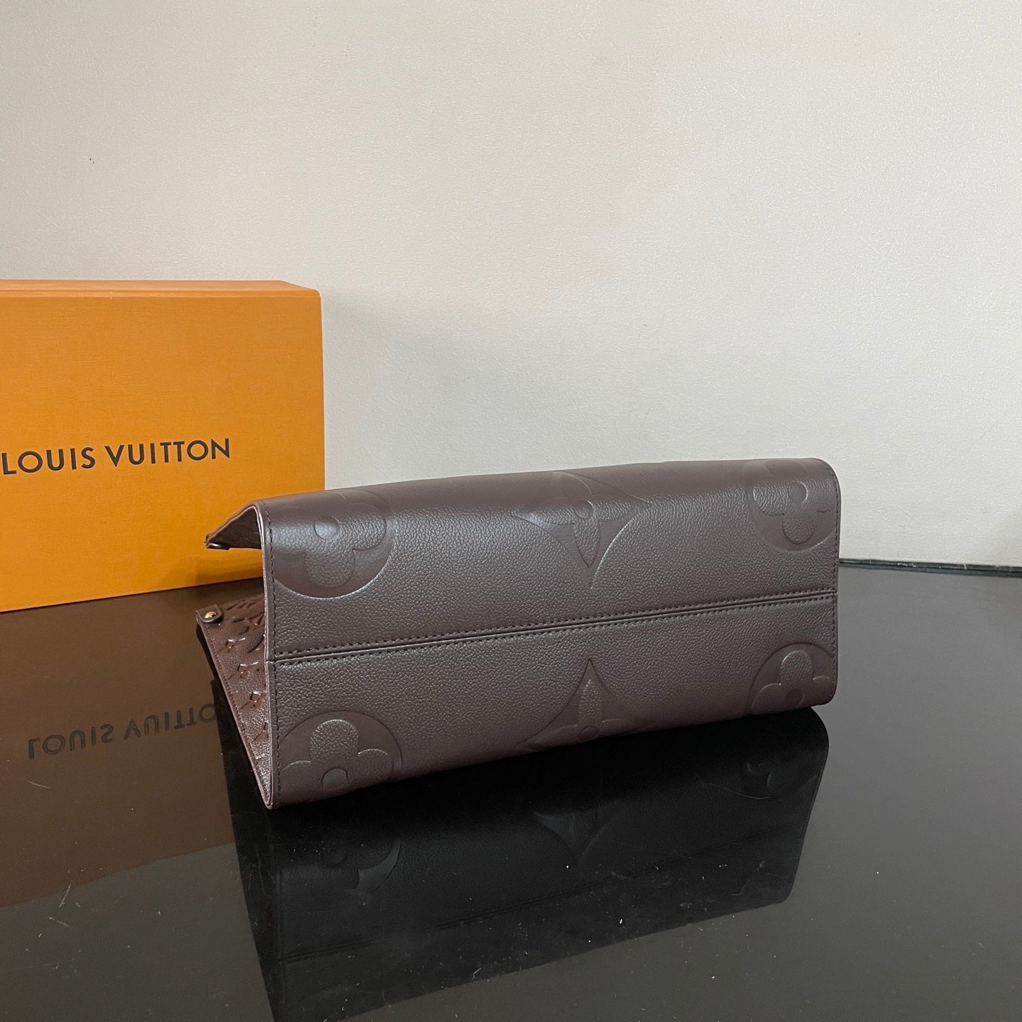 Elegant Louis Vuitton Gray Embossed Leather Tote Bag With Signature Monogram Patterns