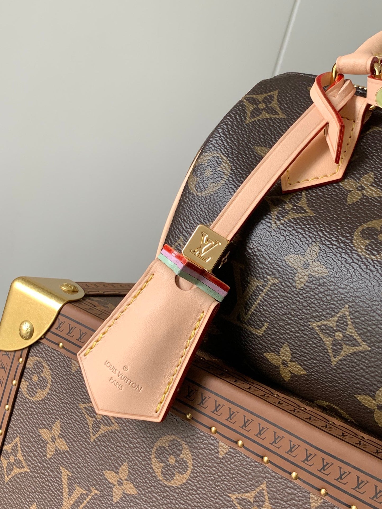 Louis Vuitton Speedy Bandoulière Bag With Colorful Charms And Stylish Strap For Fashion Enthusiasts