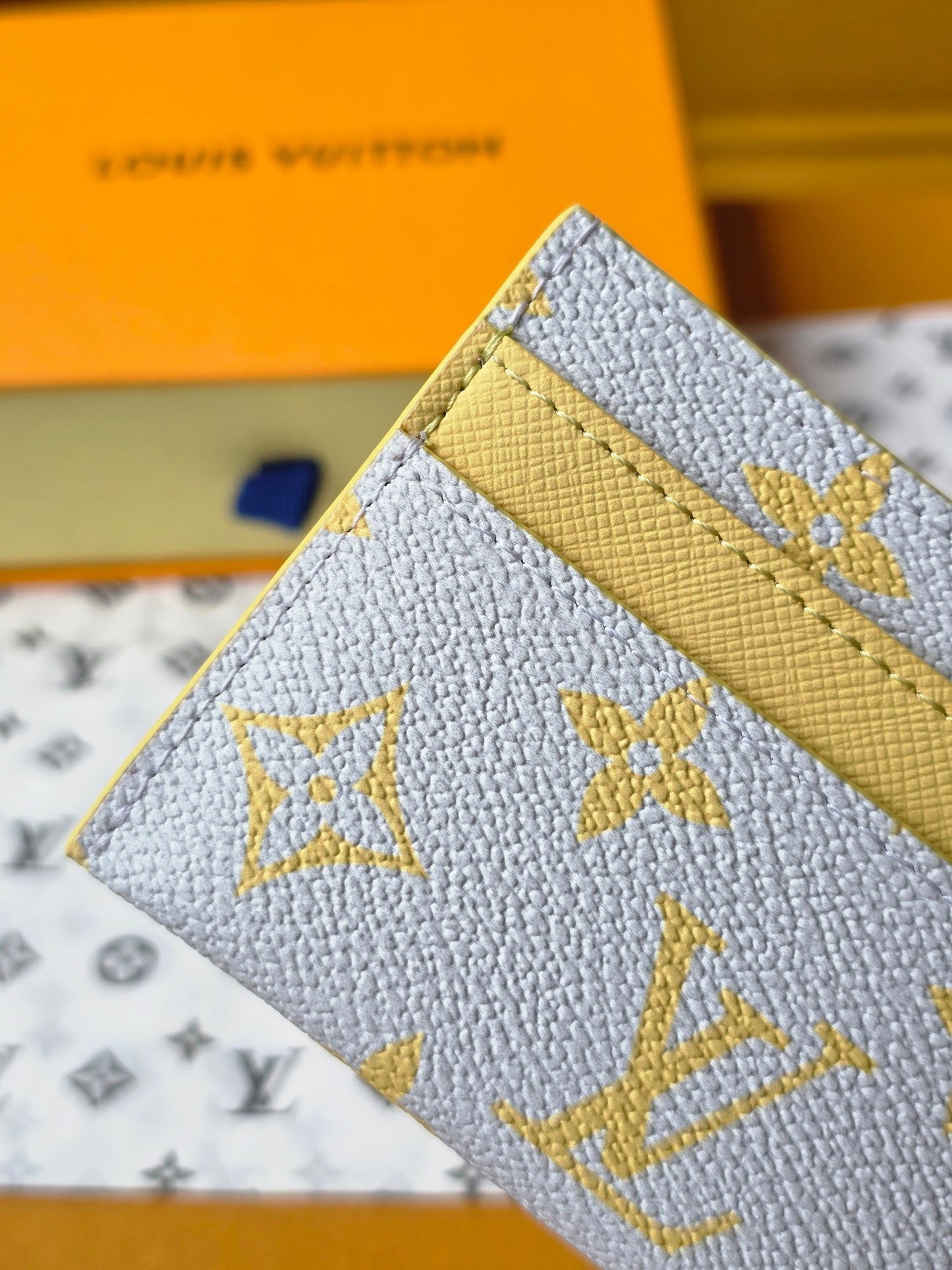 Chic Louis Vuitton Light Blue Card Holder with Gold Monogram and Yellow Accent M14771