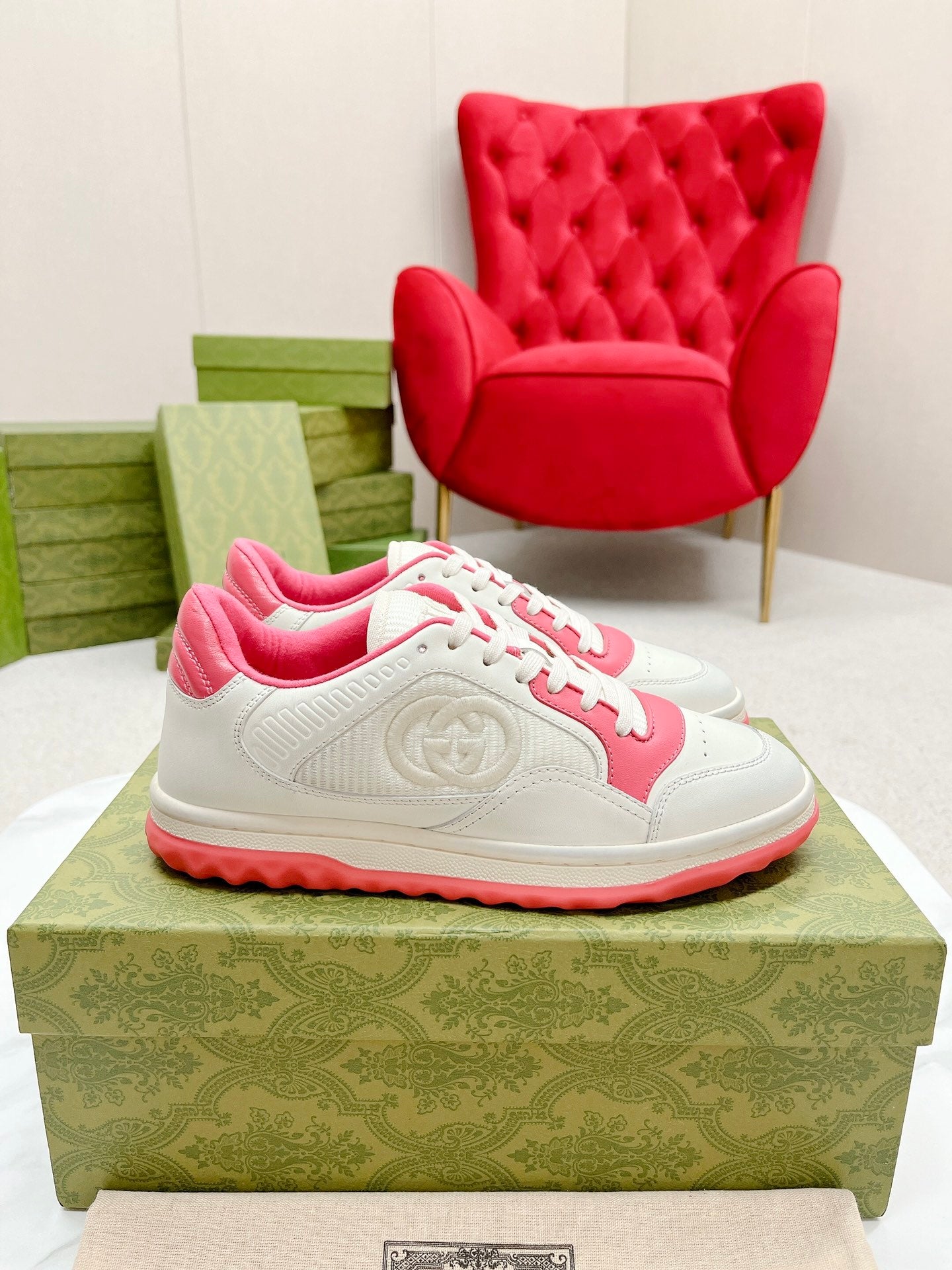 Stylish White And Pink Gucci Sneakers On Display