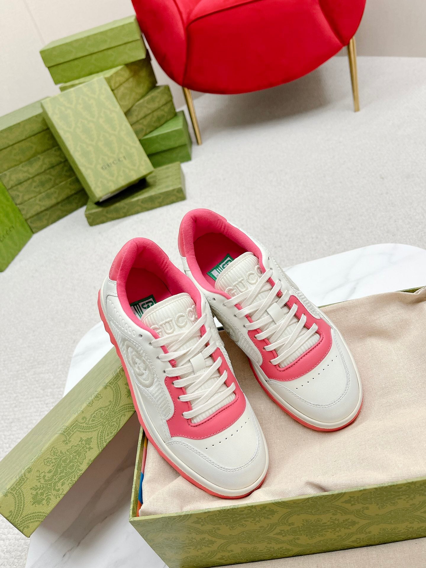 Stylish White And Pink Gucci Sneakers On Display