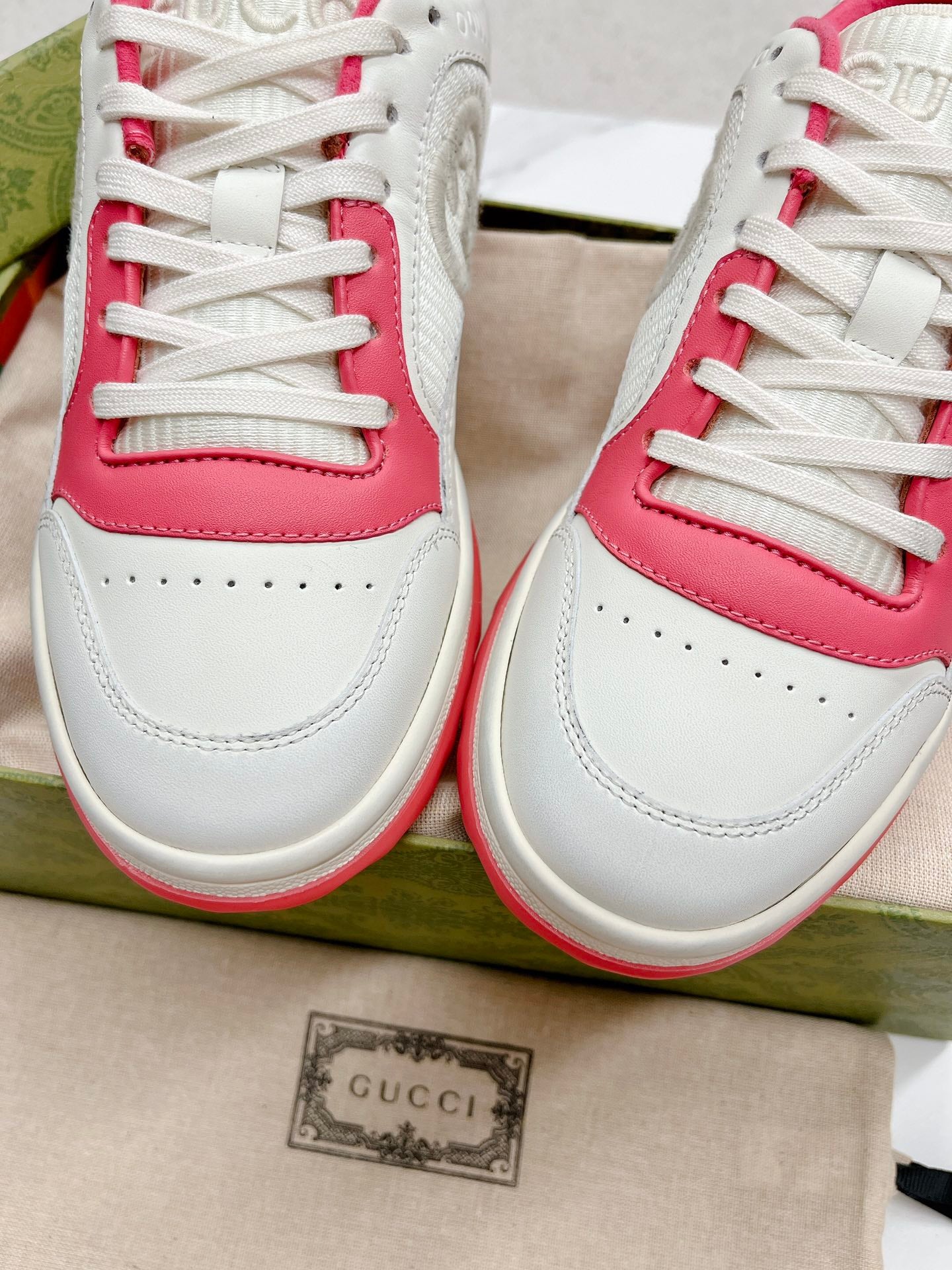 Stylish White And Pink Gucci Sneakers On Display