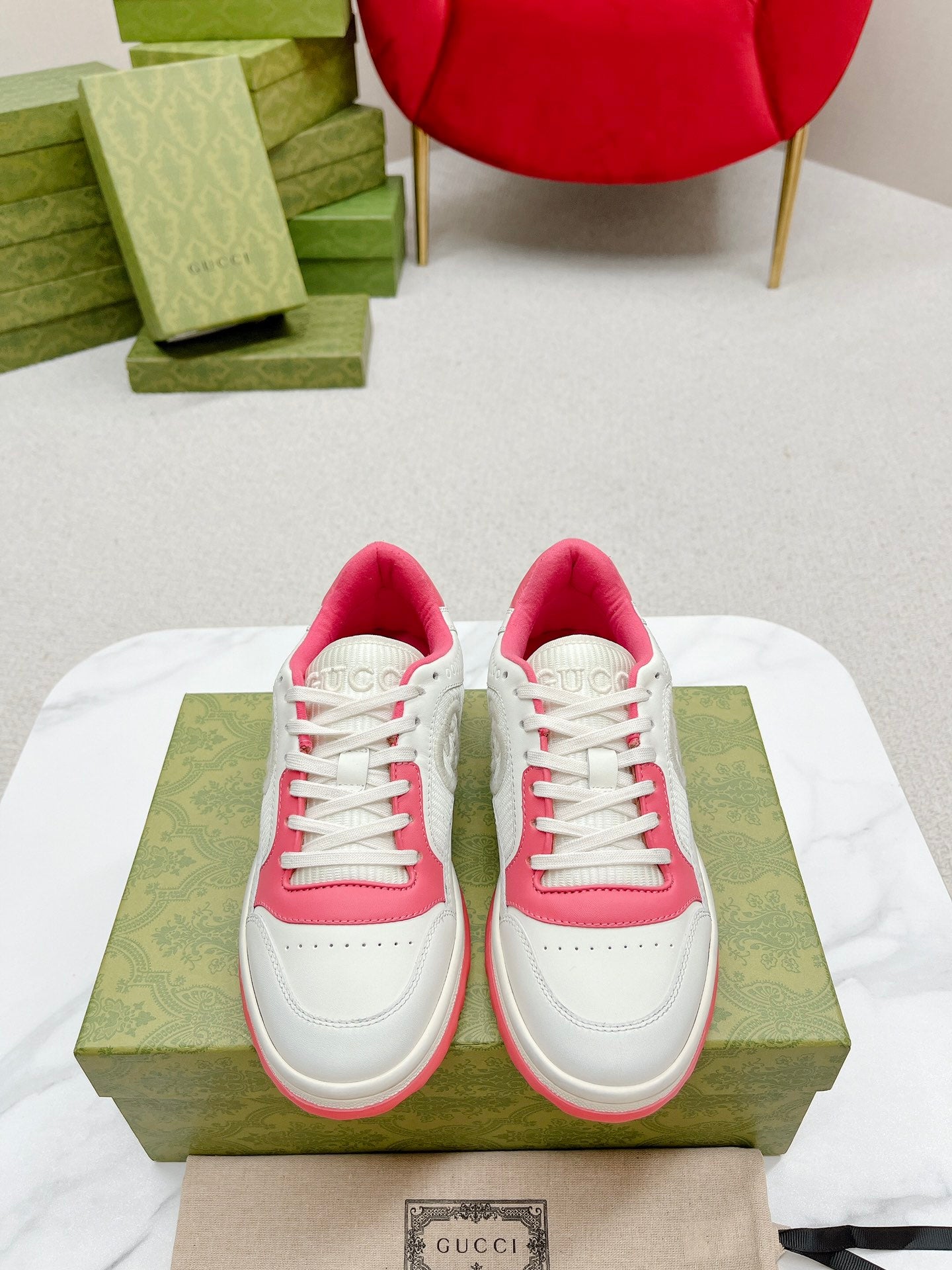Stylish White And Pink Gucci Sneakers On Display
