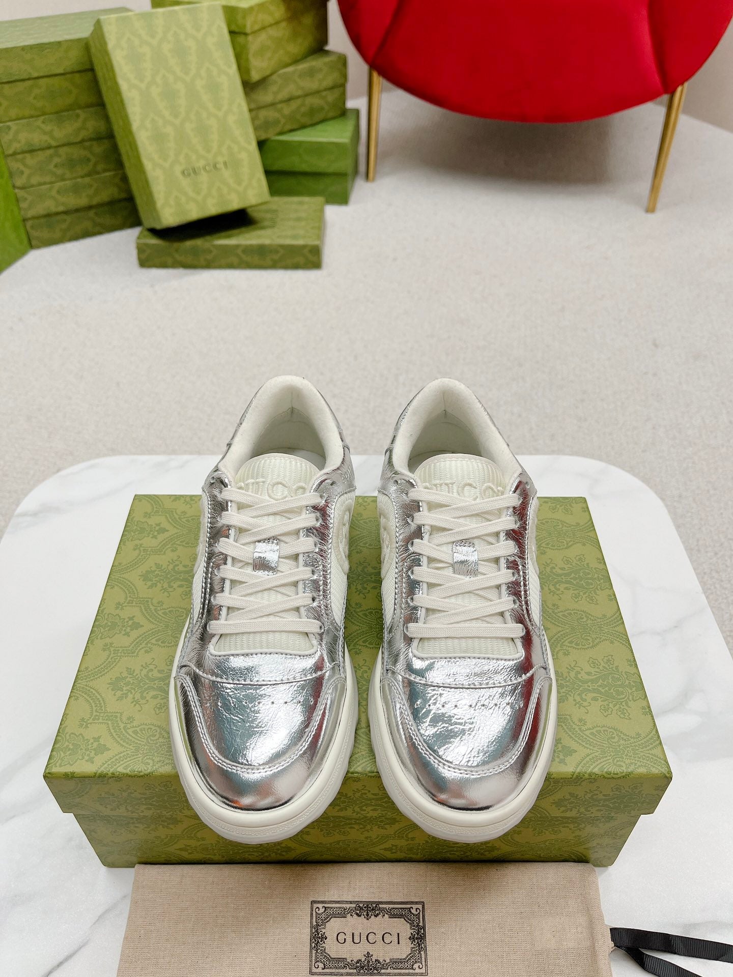 Stylish White And Pink Gucci Sneakers On Display