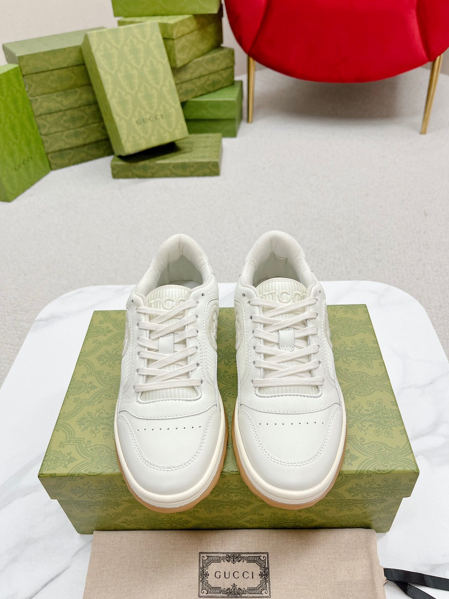 Stylish White And Pink Gucci Sneakers On Display
