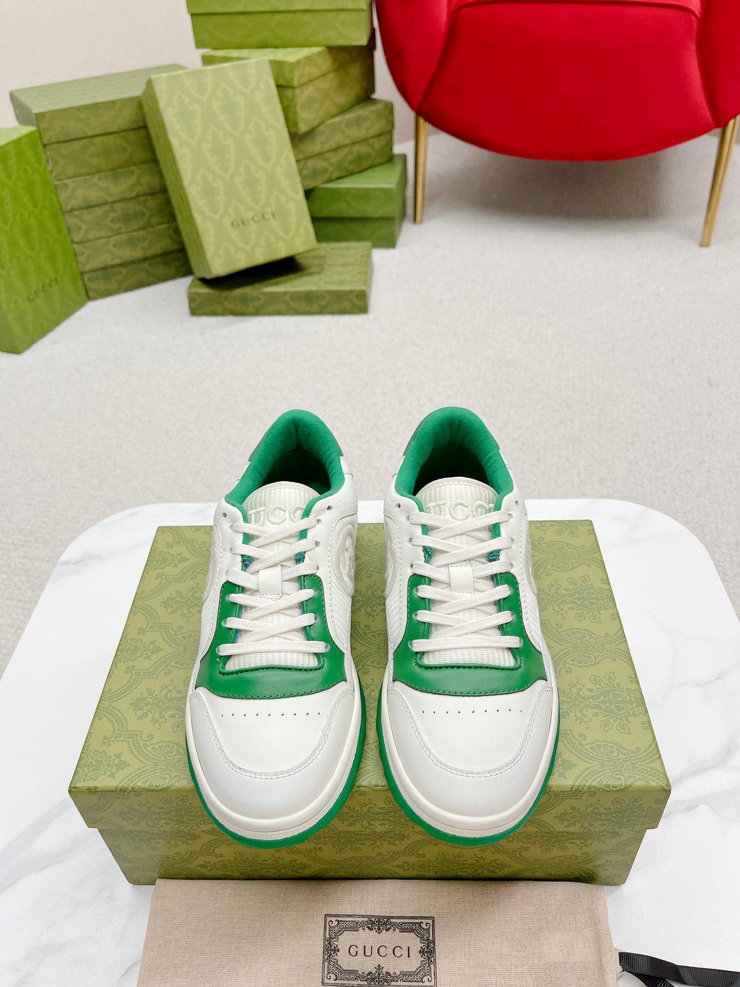 Stylish White And Pink Gucci Sneakers On Display