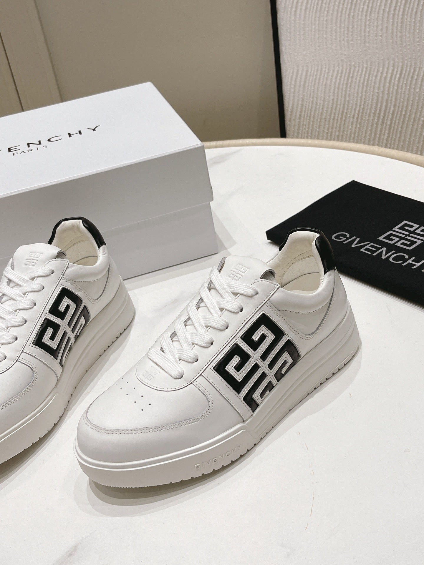 Givenchy Unisex White Sneakers With Black Accents For Luxury Casual Style