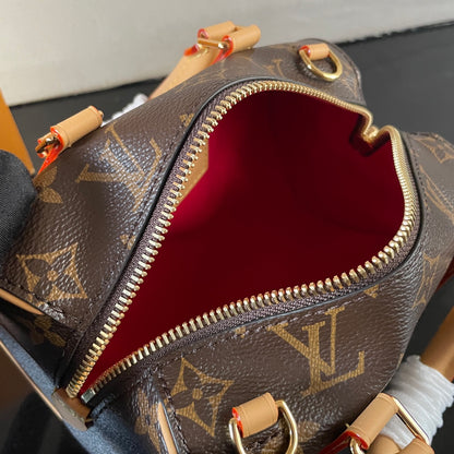 Stylish Louis Vuitton Nano Speedy Bag with Iconic Monogram and Luxe Leather Details