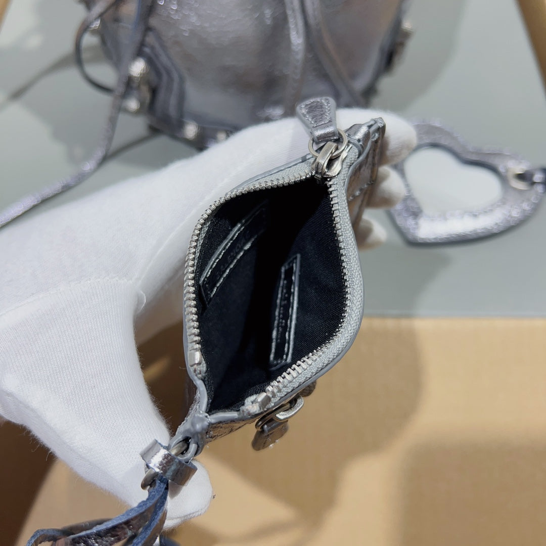 Metallic Black Balenciaga Bucket Bag with Adjustable Straps and Matching Pouch for Stylish Functionality Style No.3032