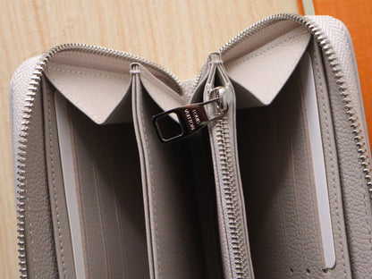 Elegant Louis Vuitton Light Gray Embossed Leather Zip Around Wallet for Luxury Enthusiasts M14228
