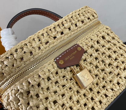 Chic Louis Vuitton Woven Straw Vanity Bag With Leather Handle And Lock Accents