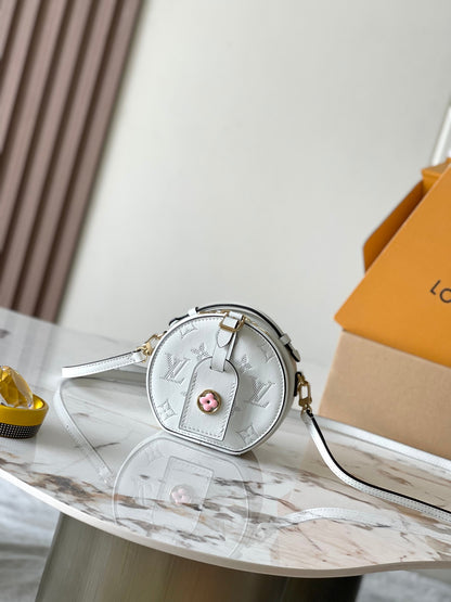 Chic Yellow LV Embossed Round Crossbody Bag With Adjustable Strap And Signature Details