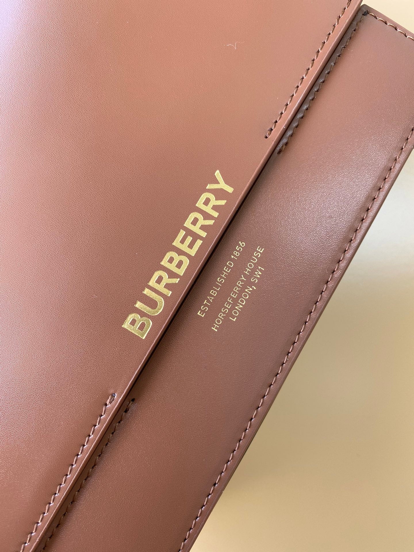 Elegant Black/Brown Burberry Crossbody Bag With Gold Branding And Adjustable Strap Style No.595155