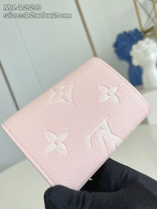 Chic Louis Vuitton Pink Leather Wallet With Embossed Monogram And Gold Accent M14229