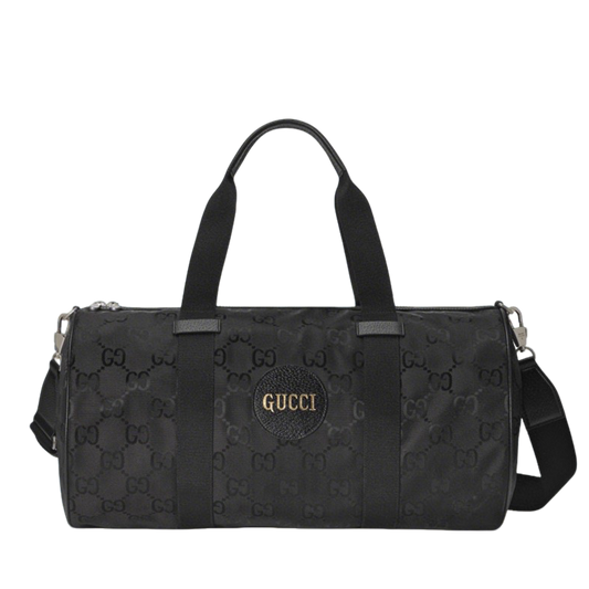 Elegant Black Gucci Duffle Bag With Signature GG Pattern And Gold Branding 658632
