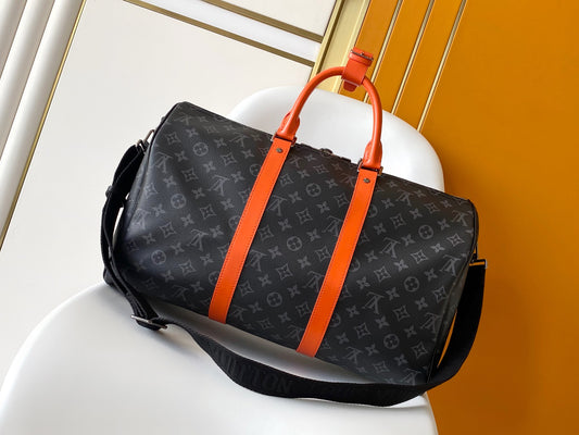 Louis Vuitton Monogram Canvas Travel Bag With Vibrant Orange Accents For Stylish Journeys