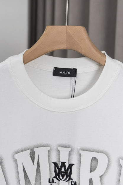 AMIRI White/Black Graphic Tee With Bold Logo For Trendy Streetwear Enthusiasts